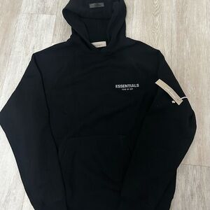 Essentials Black Logo Pullover Hoodie with tags and comes with essentials bag